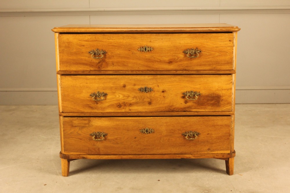 A 19th-century Swedish oak secretaire chest featuring an open hinged fall-front writing flap revealing fitted interior drawers, positioned above two large lower drawers. View II
