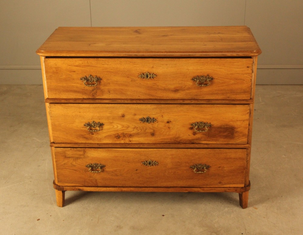 A 19th-century Swedish oak secretaire chest featuring an open hinged fall-front writing flap revealing fitted interior drawers, positioned above two large lower drawers. View III