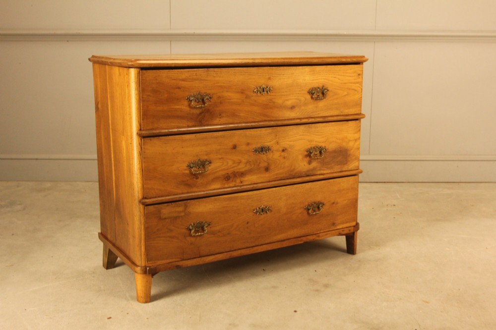 A 19th-century Swedish oak secretaire chest featuring an open hinged fall-front writing flap revealing fitted interior drawers, positioned above two large lower drawers. View V
