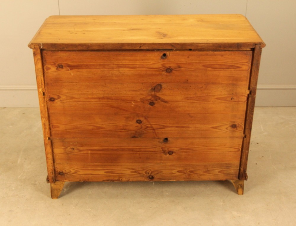 A 19th-century Swedish oak secretaire chest featuring an open hinged fall-front writing flap revealing fitted interior drawers, positioned above two large lower drawers. View X