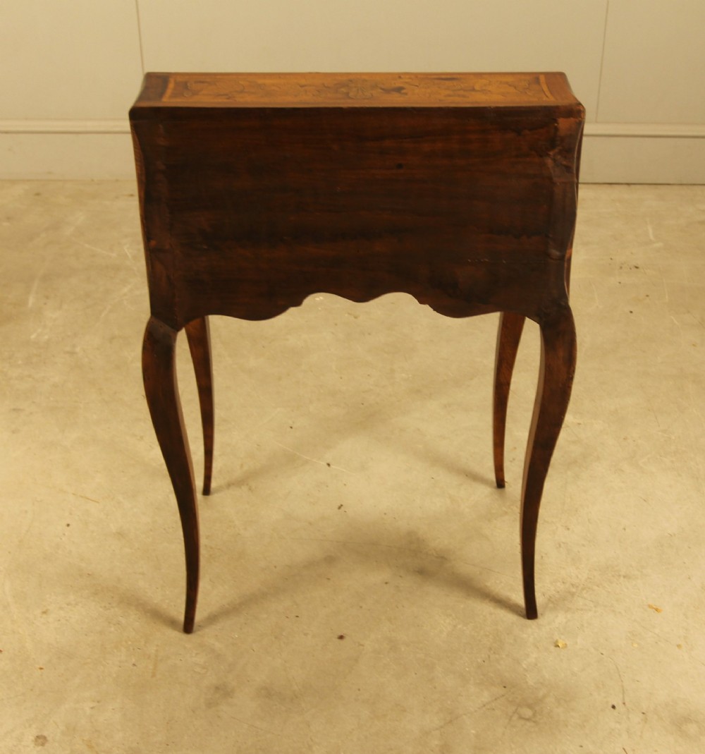 A 19th-century Italian walnut writing bureau featuring floral marquetry inlay, a slanted fall front, and slender cabriole legs. View IX