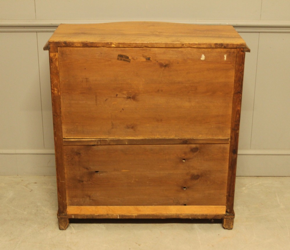 A 19th-century Swedish burr walnut chest featuring four serpentine-front drawers, bookmatched veneers, turned side pilasters, and bun feet. View XI