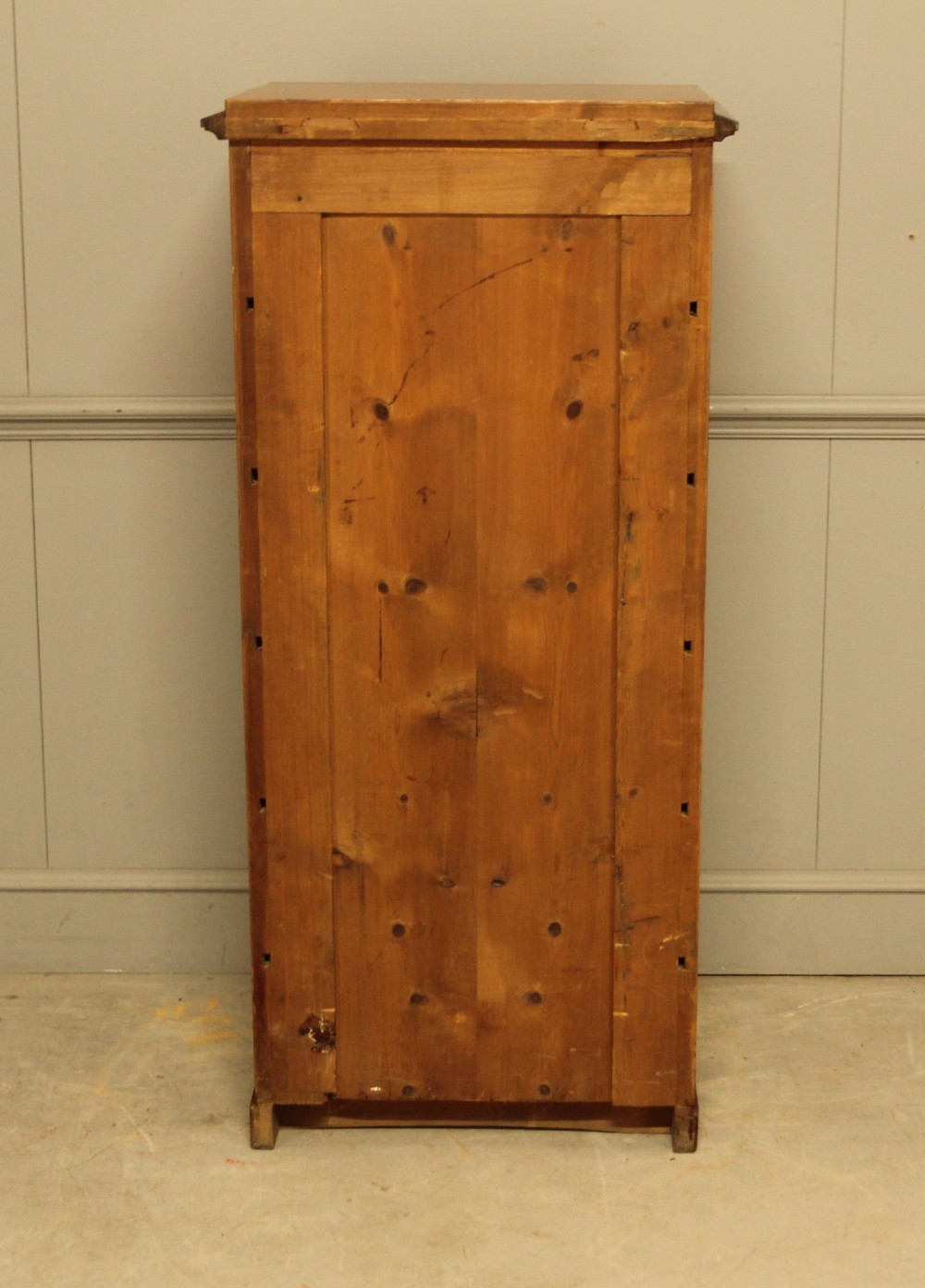 A tall 19th-century Swedish Wellington chest featuring six book-matched burr walnut drawers with turned handles, flanked by carved pilasters. View XII