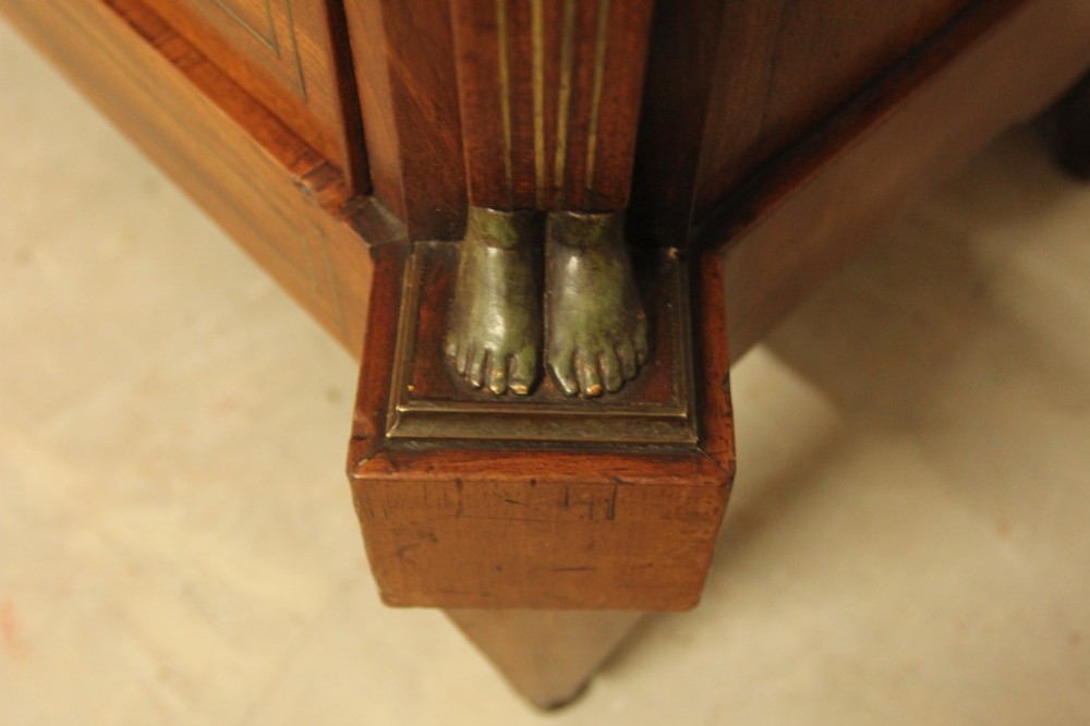 A French 19th-century mahogany tallboy chest of drawers featuring six drawers, brass ring handles, escutcheons, and fluted side pilasters topped with brass busts. View VI