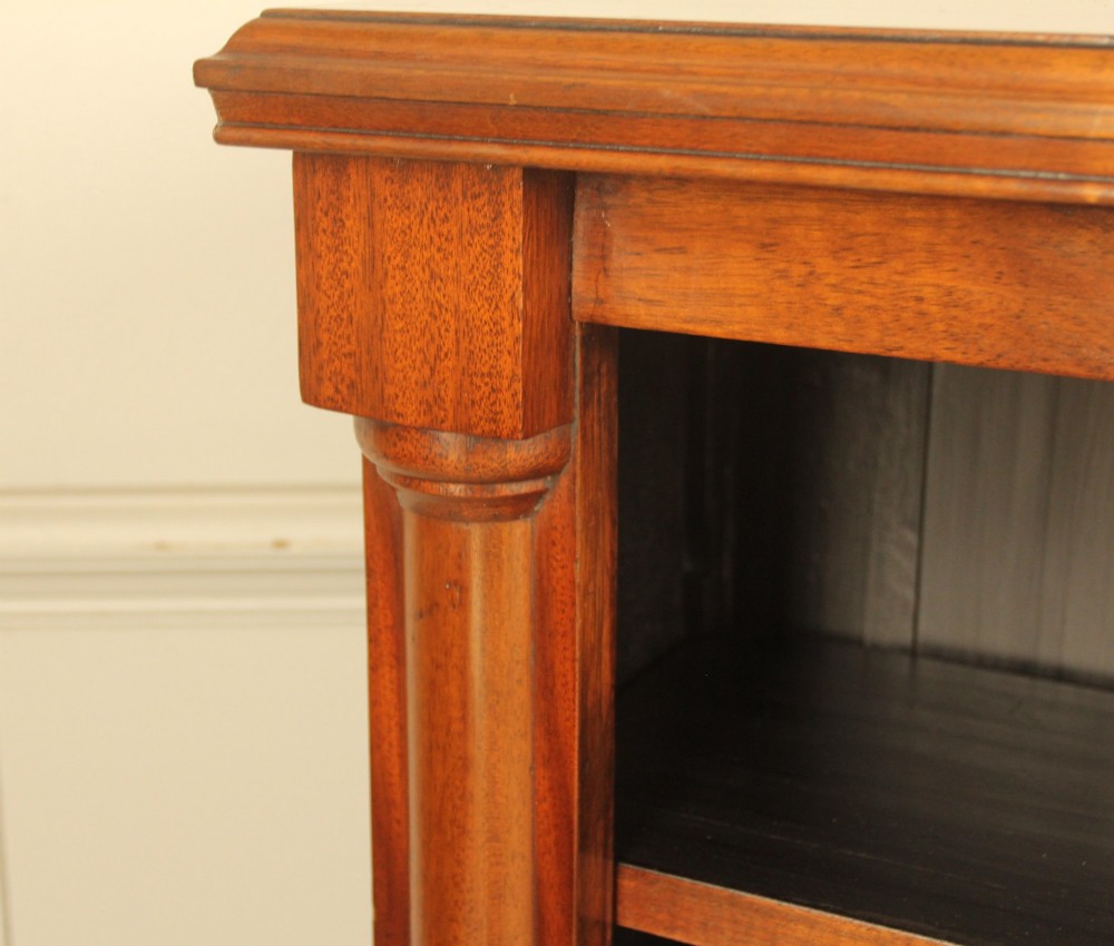 A Victorian open mahogany bookcase featuring four shelves flanked by turned pilasters on a solid plinth base. View VIII