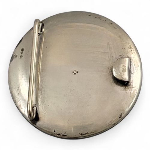 fig 4. A pair of circular Japanese Kyo-Satsuma belt buckle halves set in silver frames, decorated with intricate hand-painted birds and flowers on a cream crackle-glazed background.