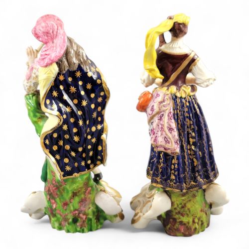 fig 2. A pair of 19th-century Bloor Derby porcelain figurines depicting a male and female musician in colourful costume on gilded rocaille bases.