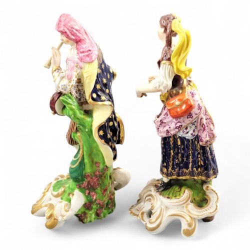 fig 3. A pair of 19th-century Bloor Derby porcelain figurines depicting a male and female musician in colourful costume on gilded rocaille bases.