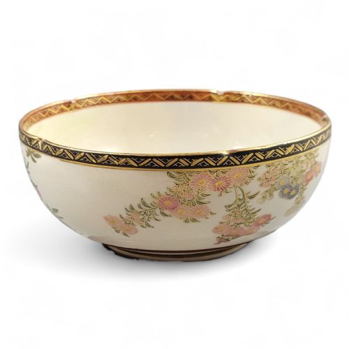 fig 1. A cream-coloured Meiji period Satsuma earthenware bowl hand-painted with floral motifs and finished with a gilded border.