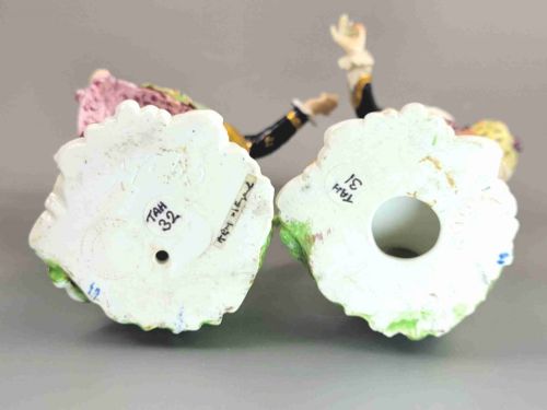fig 5. A pair of 19th-century Bloor Derby porcelain figurines depicting a shepherdess with a lamb and a shepherd with a dog, painted in multi-coloured enamels with gilded Rococo scroll bases.