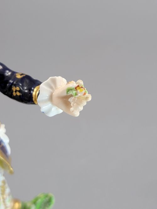 fig 6. A pair of 19th-century Bloor Derby porcelain figurines depicting a shepherdess with a lamb and a shepherd with a dog, painted in multi-coloured enamels with gilded Rococo scroll bases.