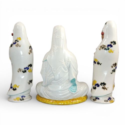 fig 2. A set of three late nineteenth-century Japanese Kutani porcelain figures depicting Kannon flanked by two standing attendants, finished in white glaze with gilded and polychrome enamelled robes.