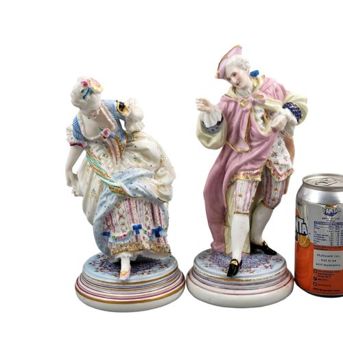fig 1. Pair of hand-painted French Paris porcelain masquerade figures depicting a lady and gallant in pastel eighteenth-century costume on gilded circular bases.