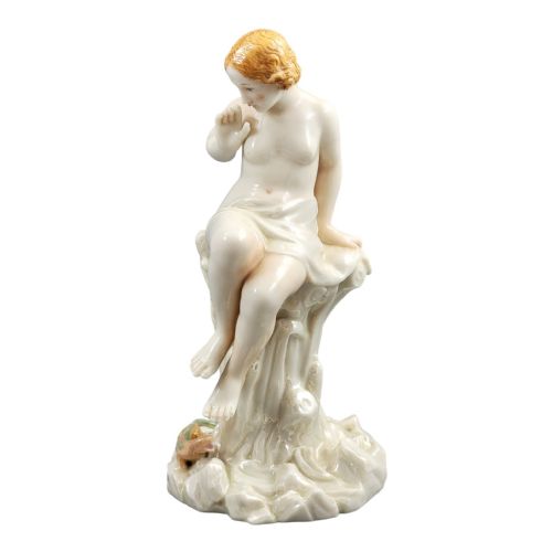 fig 1. A Victorian Royal Worcester porcelain figurine depicting a seated draped female maiden on a tree stump looking down at a lizard.