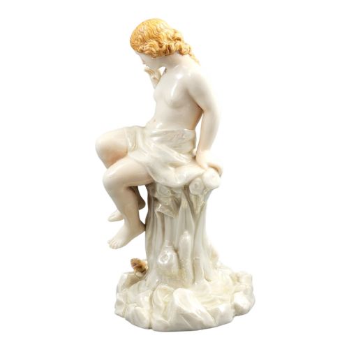fig 2. A Victorian Royal Worcester porcelain figurine depicting a seated draped female maiden on a tree stump looking down at a lizard.