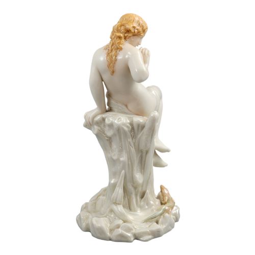 fig 3. A Victorian Royal Worcester porcelain figurine depicting a seated draped female maiden on a tree stump looking down at a lizard.