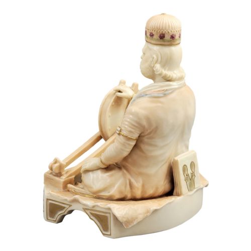 fig 2. A late 19th-century Royal Worcester blush ivory porcelain figurine depicting an Indian craftsman seated at a spinning wheel, detailed with polychrome enamel and gold gilded highlights.