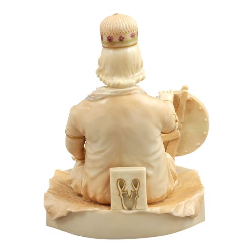 fig 4. A late 19th-century Royal Worcester blush ivory porcelain figurine depicting an Indian craftsman seated at a spinning wheel, detailed with polychrome enamel and gold gilded highlights.