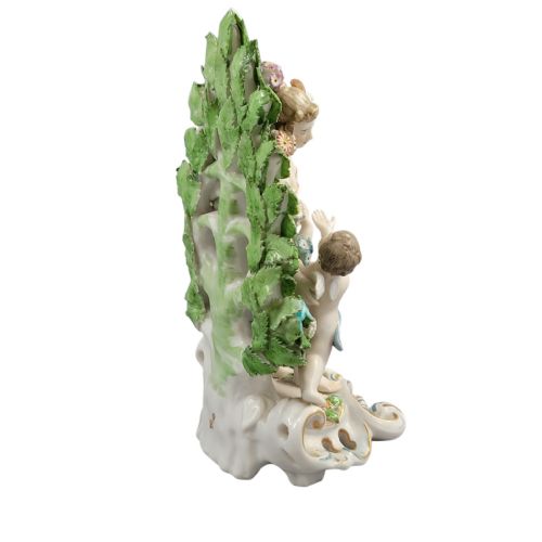 fig 4. A 19th-century Samson porcelain figurine depicting Venus and Cupid standing in front of a floral leaf bocage on a gilded scroll base.