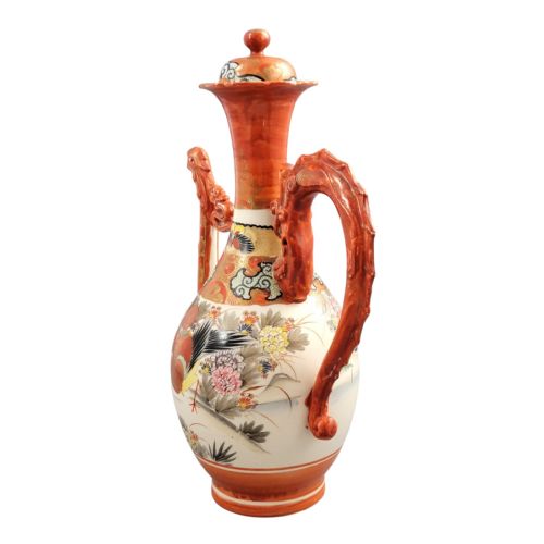 fig 1. An antique Japanese Kutani porcelain ewer featuring a moulded dragon handle, a phoenix head spout, intricate polychrome floral decoration, and iron-red and gold painted accents.