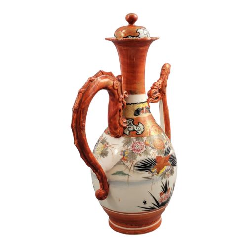 fig 2. An antique Japanese Kutani porcelain ewer featuring a moulded dragon handle, a phoenix head spout, intricate polychrome floral decoration, and iron-red and gold painted accents.