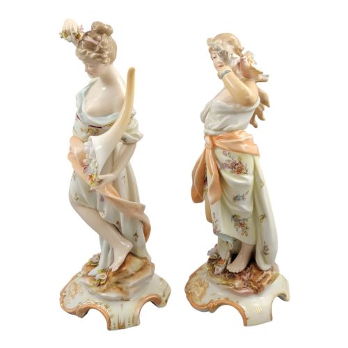 fig 2. A pair of late 18th-century Volkstedt painted porcelain allegorical figures on ornate gilded scrollwork bases.