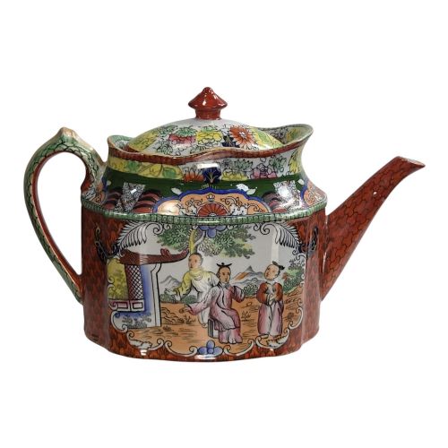fig 4. An antique Masons ironstone oval teapot featuring a red scale pattern and a hand-painted Chinoiserie scene with figures.