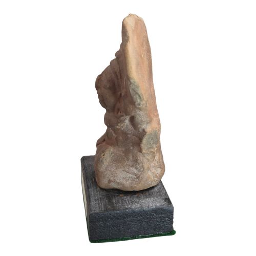 fig 1. A Pre-Columbian earthenware terracotta sculpture depicting a seated female figure with a flared headdress, mounted on a rectangular dark wooden base.