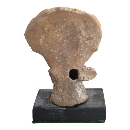fig 2. A Pre-Columbian earthenware terracotta sculpture depicting a seated female figure with a flared headdress, mounted on a rectangular dark wooden base.