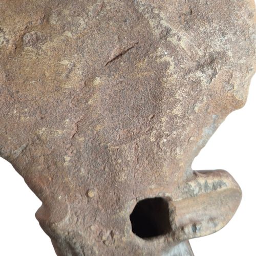 fig 4. A Pre-Columbian earthenware terracotta sculpture depicting a seated female figure with a flared headdress, mounted on a rectangular dark wooden base.