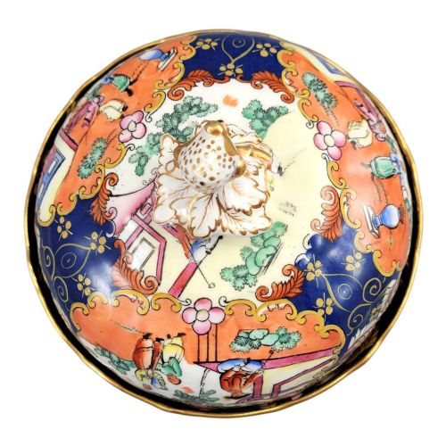 fig 6. A Regency-era Masons Patent Ironstone lidded bowl decorated with elaborate Chinoiserie motifs in cobalt blue, orange, green, and gilt detailing.