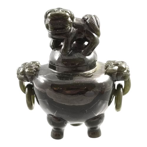 fig 1. A hand-carved dark green jade tripod censer featuring a foo dog lid finial and lion mask handles with carved loose rings.