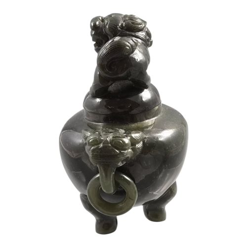 fig 3. A hand-carved dark green jade tripod censer featuring a foo dog lid finial and lion mask handles with carved loose rings.