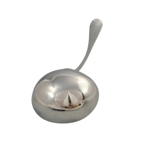 fig 1. A Georgian sterling silver soup ladle featuring a deep circular bowl, a long curved stem in the Old English pattern, and an engraved crest near the handle tip.