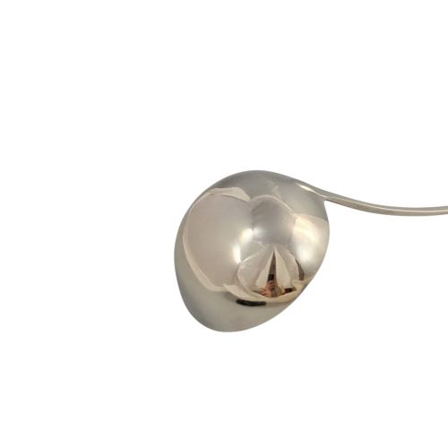 fig 3. A Georgian sterling silver soup ladle featuring a deep circular bowl, a long curved stem in the Old English pattern, and an engraved crest near the handle tip.