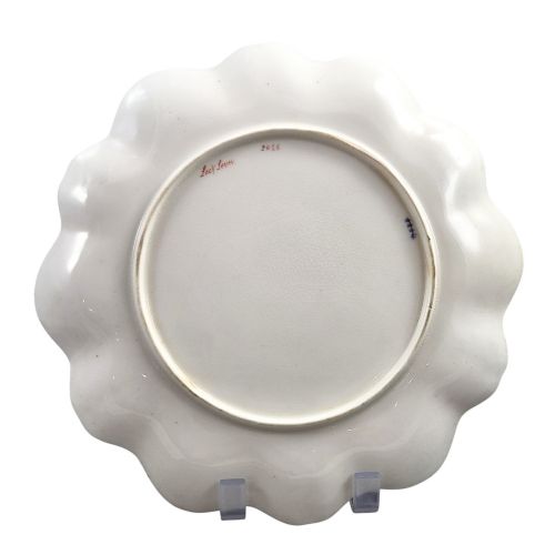 fig 2. A set of four late nineteenth-century Aynsley porcelain cabinet plates featuring hand-painted landscape scenes surrounded by cobalt blue rims with heavy gold foliage gilding.