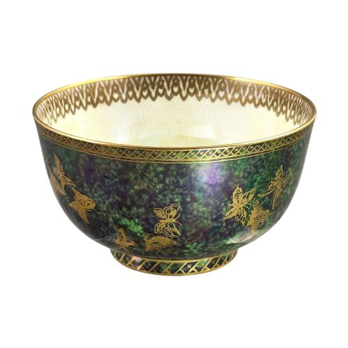 fig 1. A deep porcelain bowl featuring a mottled green iridescent exterior decorated with gilded butterflies and geometric gold borders around the rim and base.