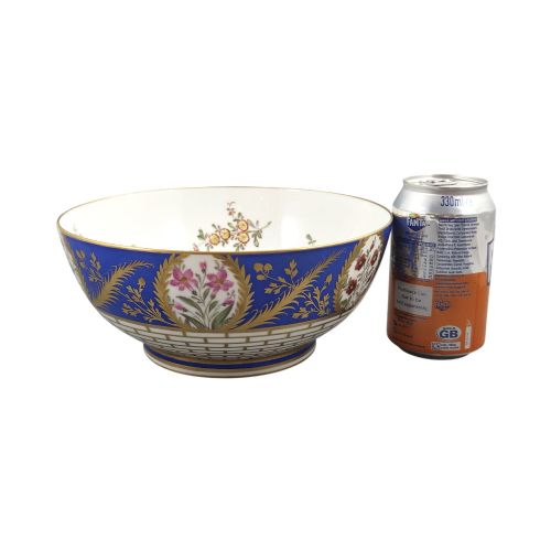fig 3. A late 19th-century Samson hard-paste porcelain footed bowl featuring a cobalt blue band with gilded leaf details, hand-painted floral cartouches, and a white brick-patterned base.