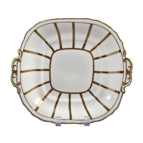 fig 1. A Victorian Davenport bone china sauce tureen with lid and undertray, decorated with white glaze, gilded radial stripes, and an artichoke finial.