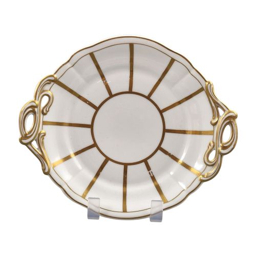 fig 4. A Victorian Davenport bone china sauce tureen with lid and undertray, decorated with white glaze, gilded radial stripes, and an artichoke finial.