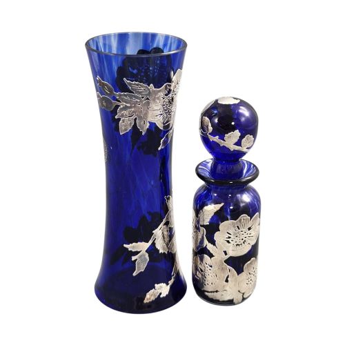 fig 3. A cobalt blue glass vase and matching perfume bottle with stopper, both featuring intricate sterling silver floral overlay.