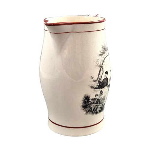 fig 1. A Georgian creamware jug featuring a black transfer-printed hunting scene and terracotta red painted rim accents against a cream glaze.
