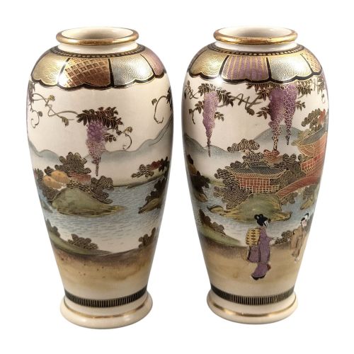 fig 3. A pair of baluster-shaped Japanese Satsuma earthenware vases decorated with figures of women and children, wisteria flowers, and gold embellishments against a cream crackle glaze background.