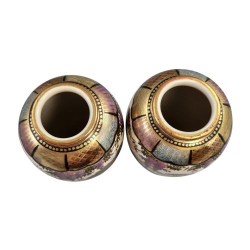 fig 4. A pair of baluster-shaped Japanese Satsuma earthenware vases decorated with figures of women and children, wisteria flowers, and gold embellishments against a cream crackle glaze background.