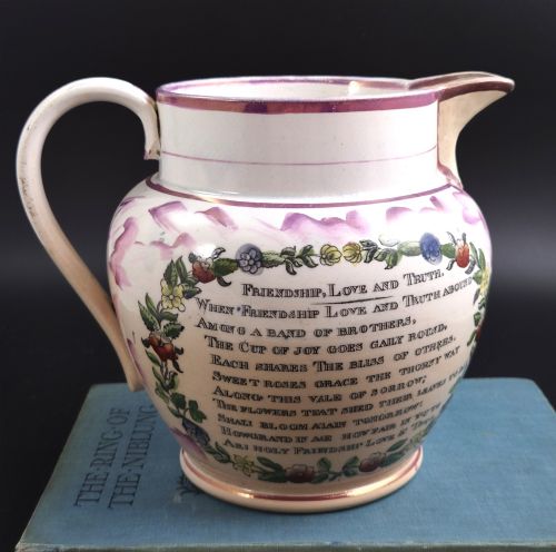 fig 3. An antique cream earthenware jug decorated with pink splash lustre glaze and a central transfer print depicting the Iron Bridge over the Wear.