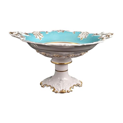 fig 3. A Victorian Coalport bone china tazza featuring a turquoise border, central floral motif, gilded scroll accents, and a footed stem base.