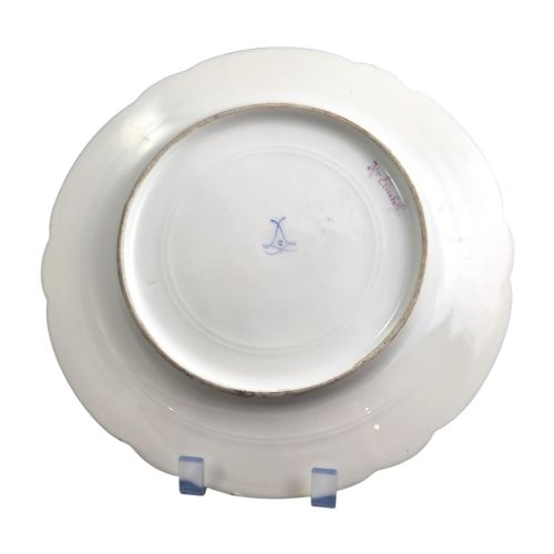fig 3. A circular porcelain cabinet plate featuring a central hand-painted portrait of a woman framed by a deep cobalt blue rim with gold scrollwork.