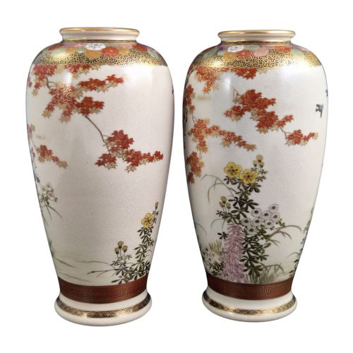 fig 2. A pair of Japanese Satsuma earthenware vases decorated with intricate hand-painted floral motifs, autumn maple leaves, chrysanthemums, and gold accents over a crackle glaze.
