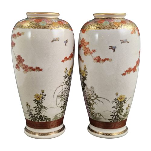 fig 3. A pair of Japanese Satsuma earthenware vases decorated with intricate hand-painted floral motifs, autumn maple leaves, chrysanthemums, and gold accents over a crackle glaze.