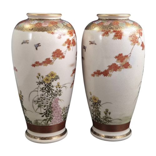 fig 4. A pair of Japanese Satsuma earthenware vases decorated with intricate hand-painted floral motifs, autumn maple leaves, chrysanthemums, and gold accents over a crackle glaze.